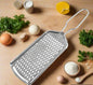 Stainless steel zester grater for zesting citrus, grating cheese, and nutmeg in the kitchen.